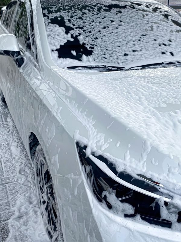 Thick foam over dark paint during a hand wash
